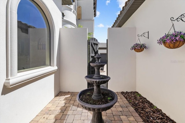 view of patio featuring a gate