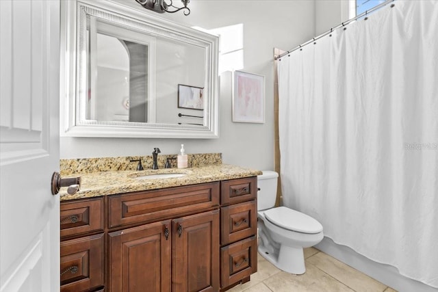 full bathroom with tile patterned flooring, toilet, and vanity