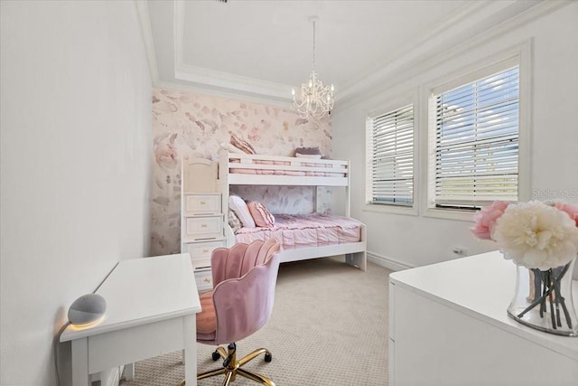 carpeted bedroom with a tray ceiling, a notable chandelier, baseboards, and ornamental molding