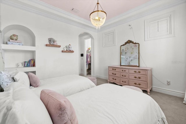 bedroom featuring visible vents, arched walkways, light colored carpet, and ornamental molding