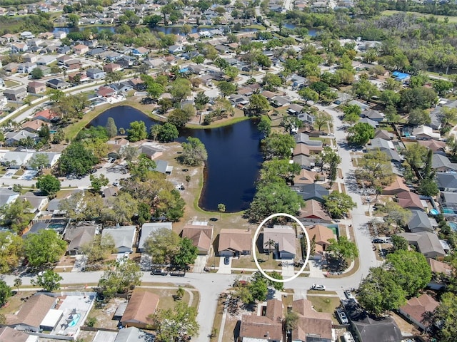 aerial view with a residential view and a water view