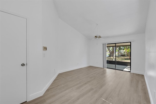 empty room featuring ceiling fan, baseboards, light wood-style flooring, and vaulted ceiling