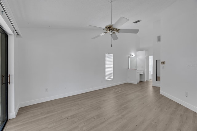 interior space featuring visible vents, light wood-style flooring, and baseboards