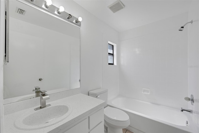 bathroom featuring visible vents, toilet, vanity, and shower / tub combination