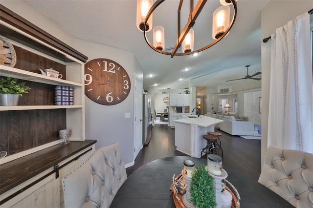 dining room with visible vents, dark wood-type flooring, and a ceiling fan