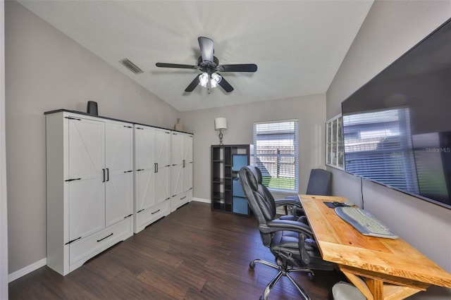 office area featuring visible vents, baseboards, dark wood finished floors, lofted ceiling, and a ceiling fan