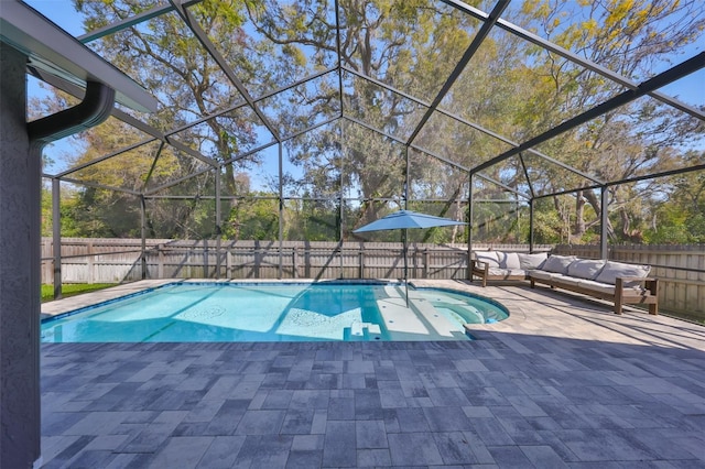 view of swimming pool featuring a fenced backyard, outdoor lounge area, a fenced in pool, a lanai, and a patio area