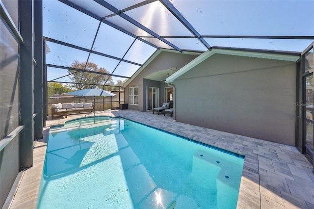 view of pool featuring a patio area, a lanai, and fence