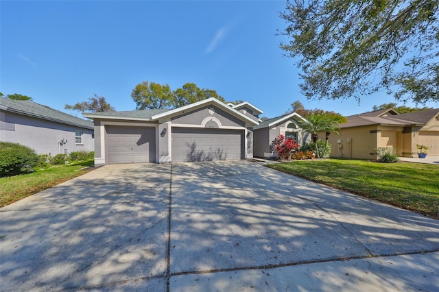 ranch-style house featuring stucco siding, a front lawn, an attached garage, and driveway