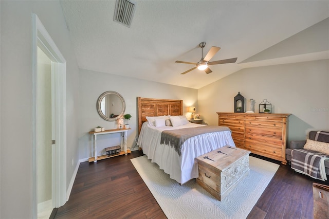 bedroom featuring visible vents, baseboards, ceiling fan, dark wood-style flooring, and vaulted ceiling