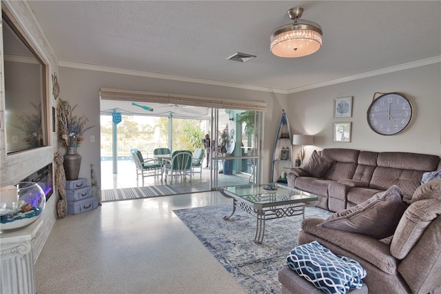 living area featuring visible vents, crown molding, and speckled floor