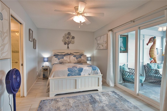 bedroom with access to outside, a ceiling fan, baseboards, and a textured ceiling