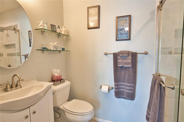 full bath featuring a shower with door, toilet, and vanity