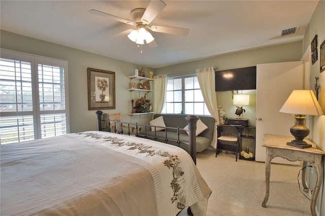 bedroom featuring visible vents and ceiling fan