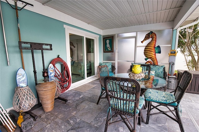 sunroom with wooden ceiling