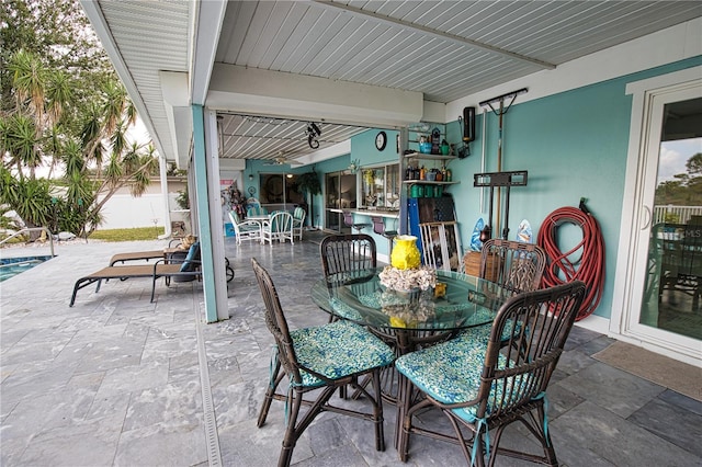 view of patio featuring outdoor dining area