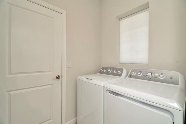 clothes washing area with laundry area and separate washer and dryer