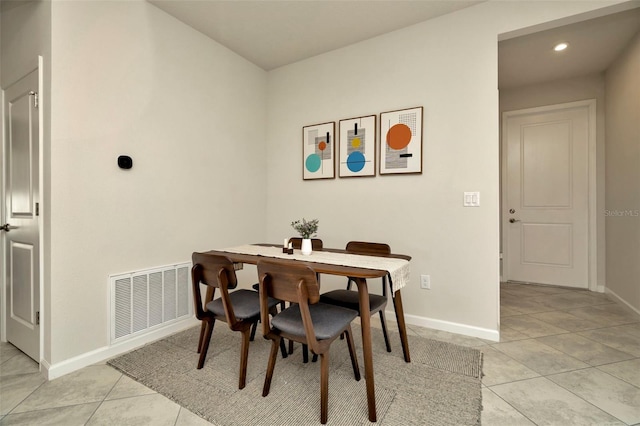 dining area with light tile patterned flooring, baseboards, and visible vents