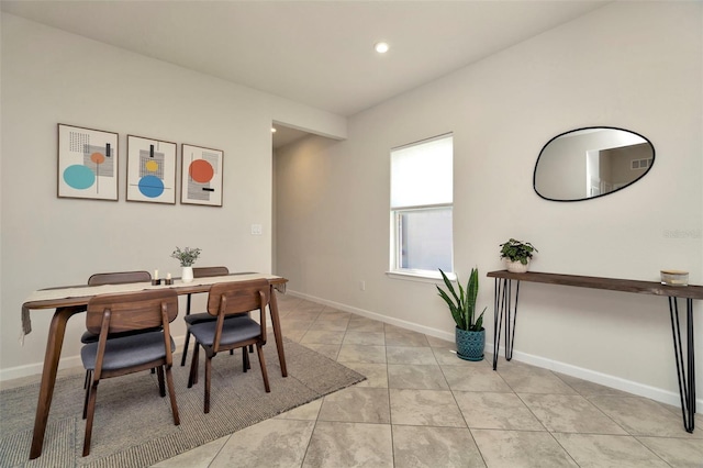 dining space featuring light tile patterned flooring, recessed lighting, and baseboards