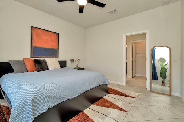 bedroom featuring light tile patterned flooring, visible vents, a ceiling fan, and baseboards