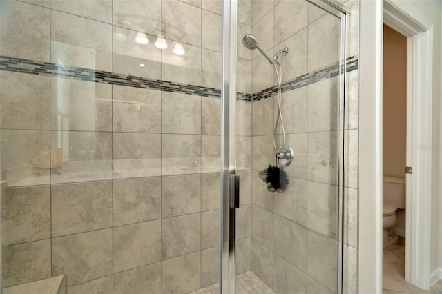 full bath with a shower stall and toilet