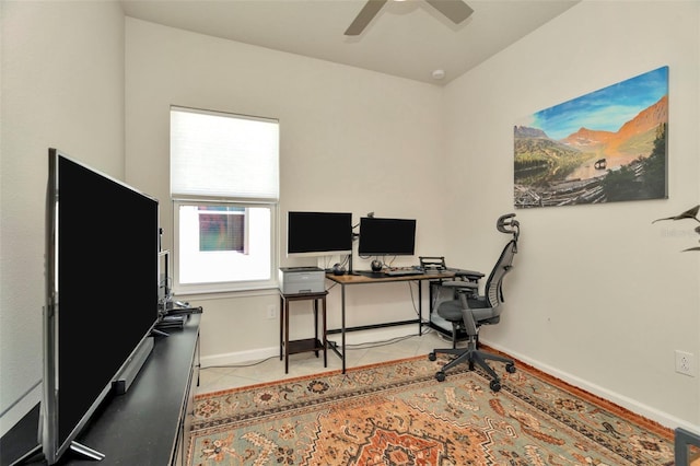 office with light tile patterned floors, a ceiling fan, and baseboards