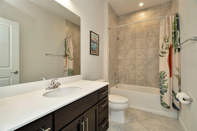 bathroom with tile patterned floors, shower / tub combo with curtain, toilet, baseboards, and vanity