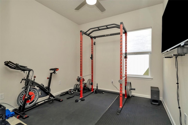 workout room featuring a ceiling fan and baseboards