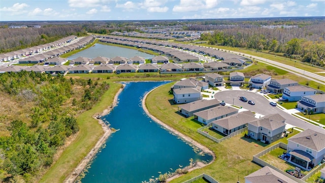 birds eye view of property featuring a residential view and a water view