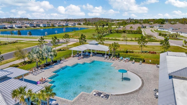 birds eye view of property featuring a residential view and a water view