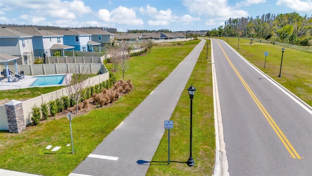 birds eye view of property with a residential view