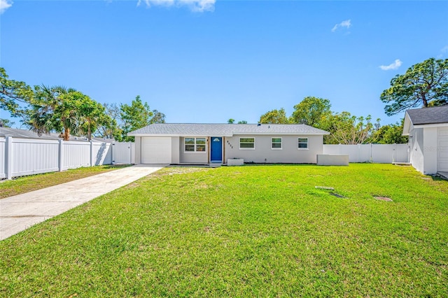 view of front of home featuring an attached garage, a fenced backyard, driveway, stucco siding, and a front lawn