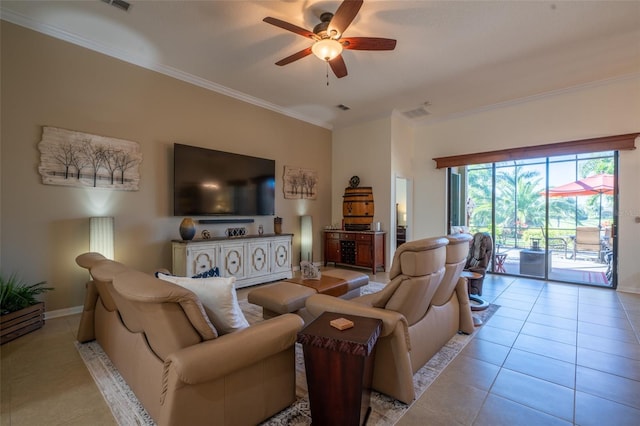 living area with visible vents, crown molding, baseboards, ceiling fan, and light tile patterned floors