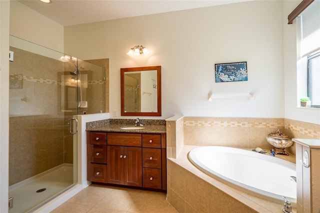 full bathroom with tile patterned flooring, a shower stall, vanity, and a bath