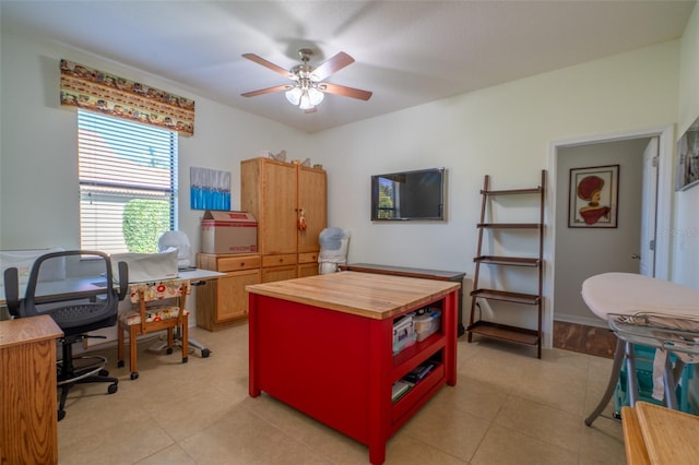 office space featuring light tile patterned flooring and ceiling fan