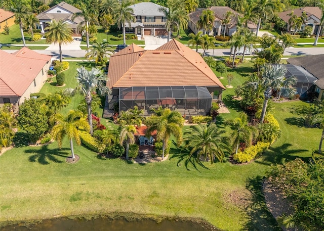 birds eye view of property with a residential view and a water view