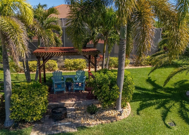 view of home's community with a yard, a pergola, and a patio area