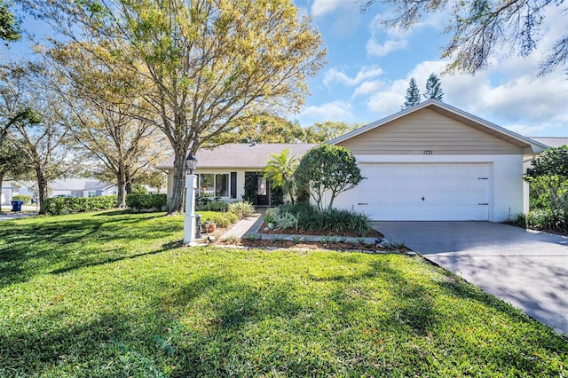 single story home featuring a front lawn, a garage, and driveway