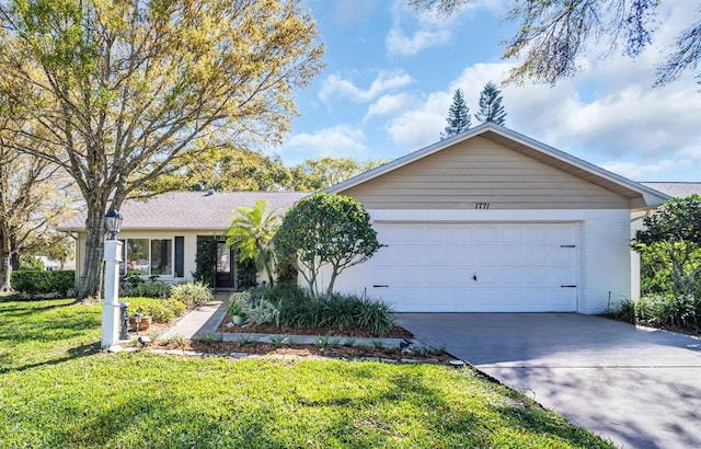 ranch-style house with a garage, driveway, and a front lawn