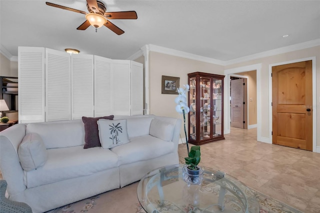 living room featuring crown molding, baseboards, and ceiling fan