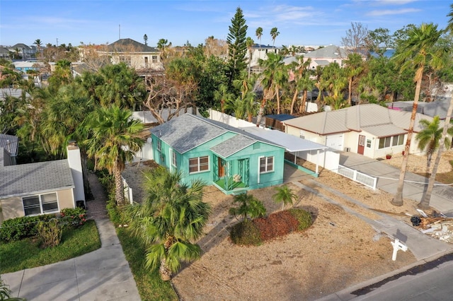 view of front of property with concrete driveway and a residential view