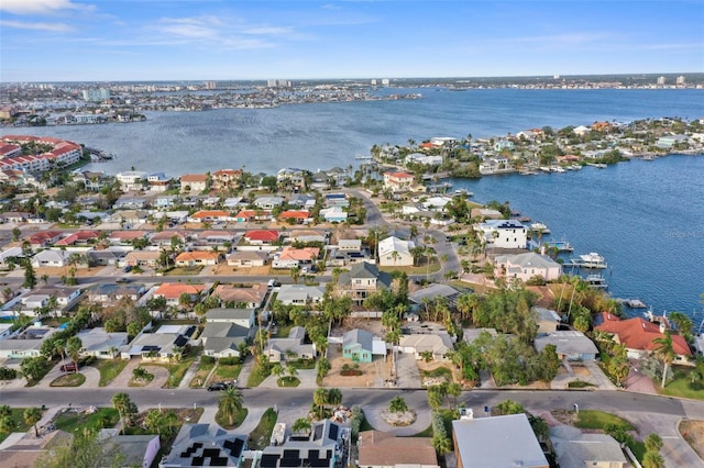 drone / aerial view featuring a residential view and a water view