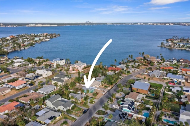 bird's eye view featuring a residential view and a water view