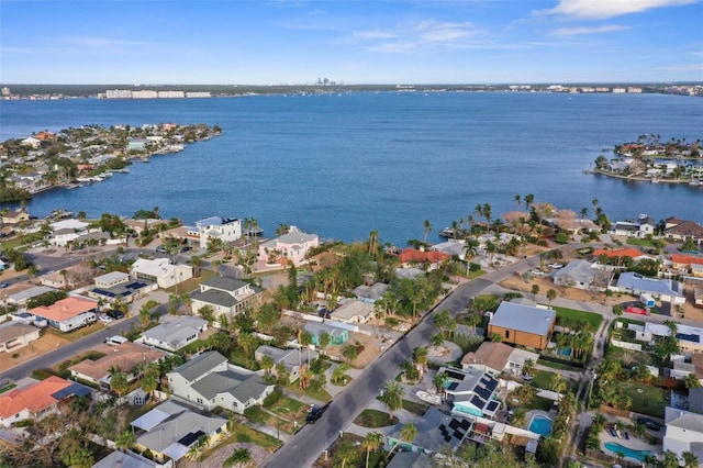 bird's eye view with a residential view and a water view