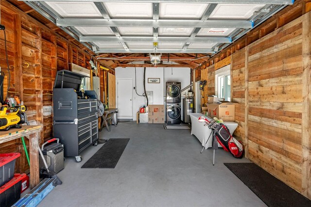 garage with washer / dryer and wood walls