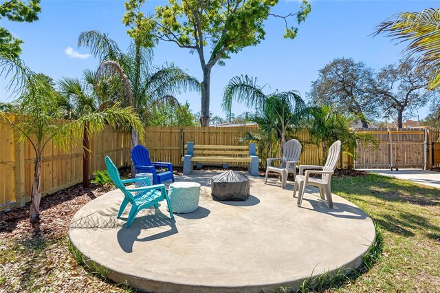 view of patio featuring a fire pit and a fenced backyard