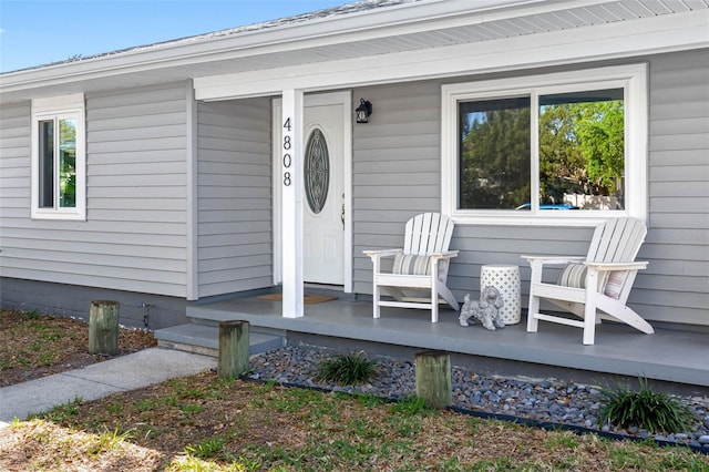 doorway to property with a porch