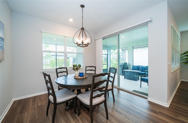 dining space with recessed lighting, a chandelier, baseboards, and wood finished floors