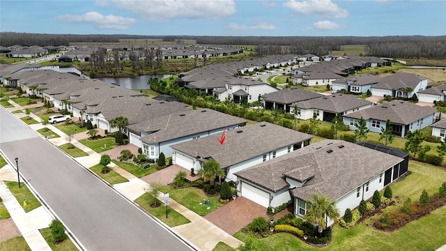 aerial view featuring a residential view and a water view