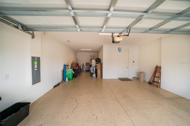 garage with electric panel and a garage door opener